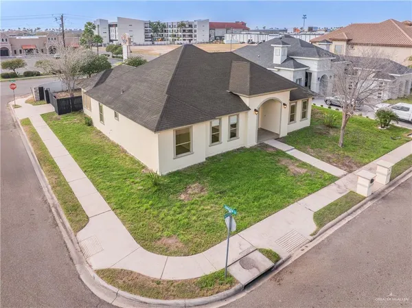 a aerial view of a house with a yard