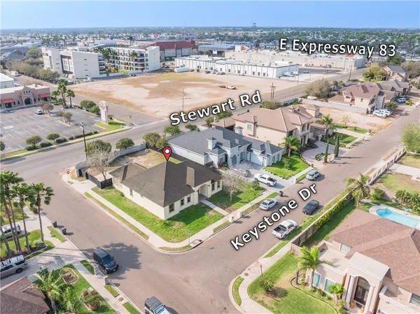 an aerial view of residential houses with outdoor space