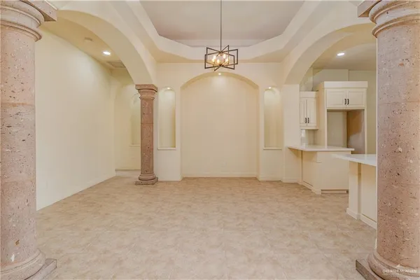 a view of a kitchen with a sink and refrigerator in a kitchen