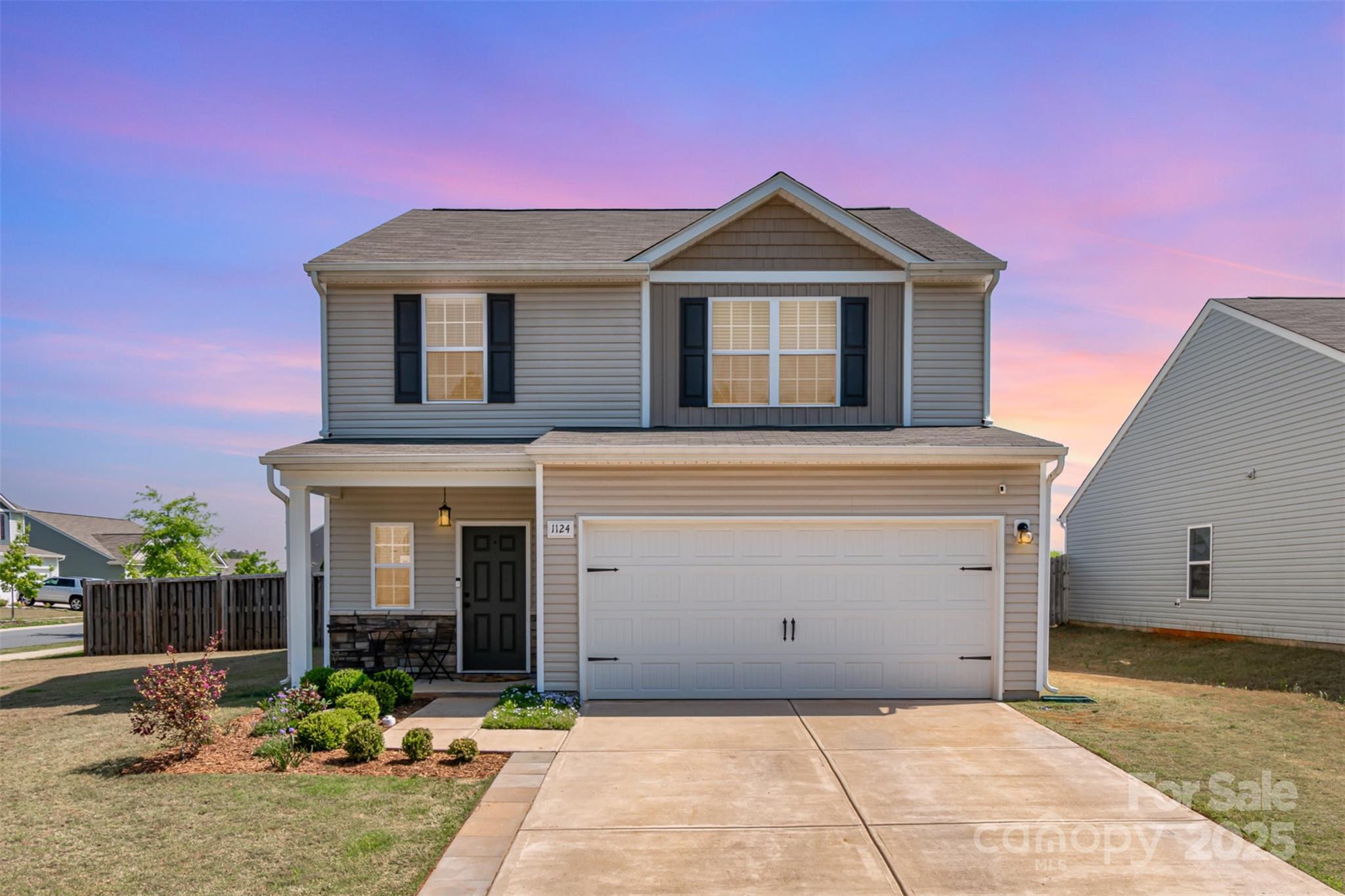 1124 Culver Spring Way Charlotte, NC 28215 - Photo 1 of 32 a front view of a house with garden