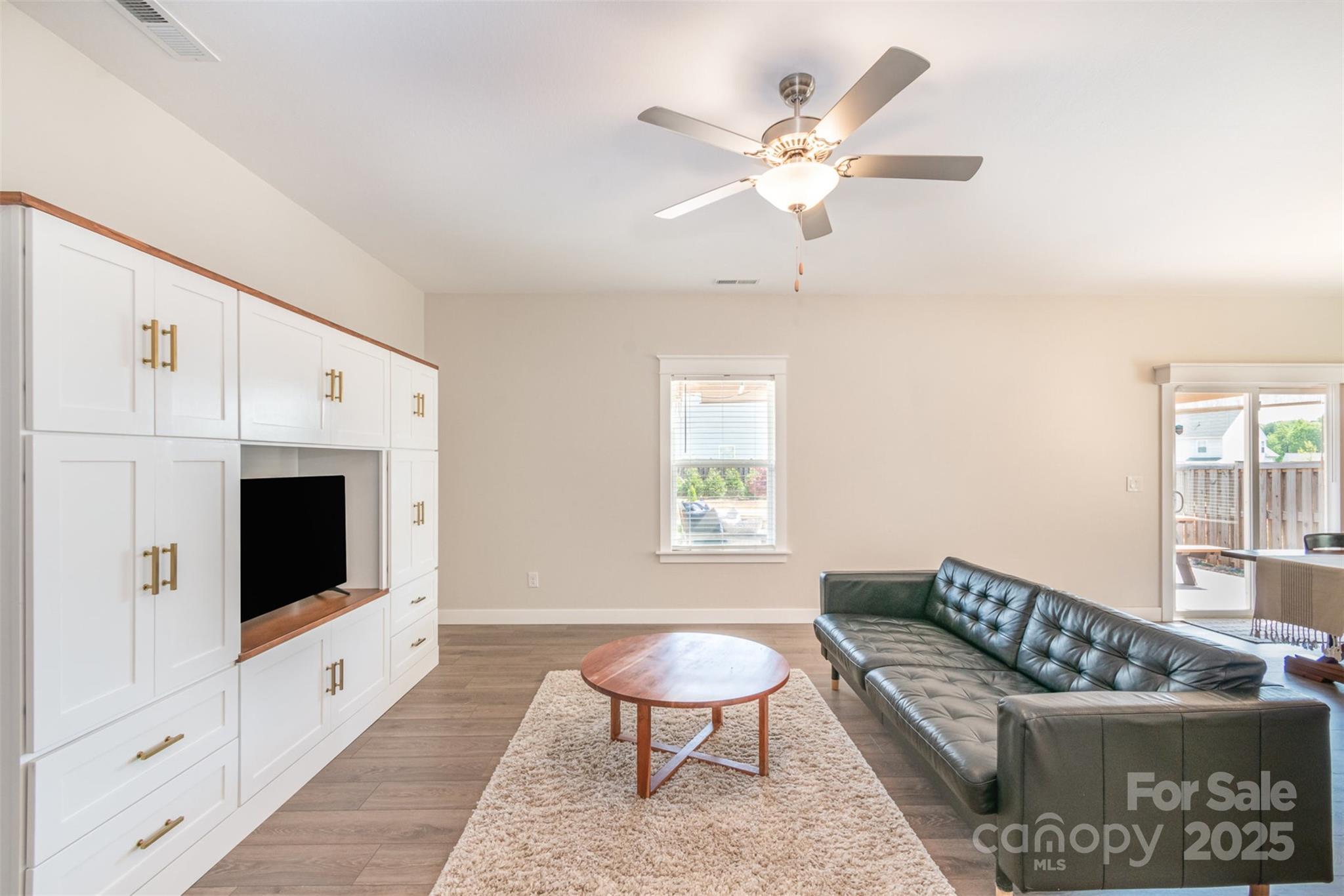 1124 Culver Spring Way Charlotte, NC 28215 - Photo 11 of 32 a living room with furniture and a flat screen tv