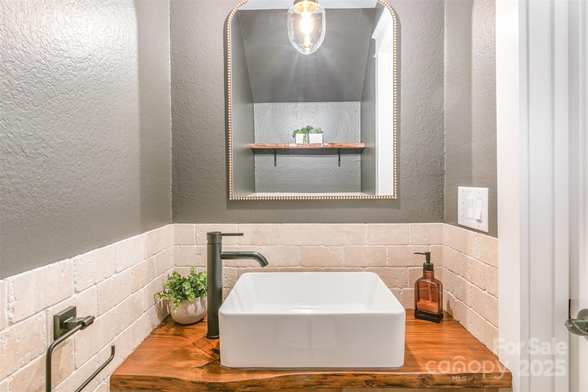 1124 Culver Spring Way Charlotte, NC 28215 - Photo 12 of 32 a white bath tub sitting in a bathroom next to a window