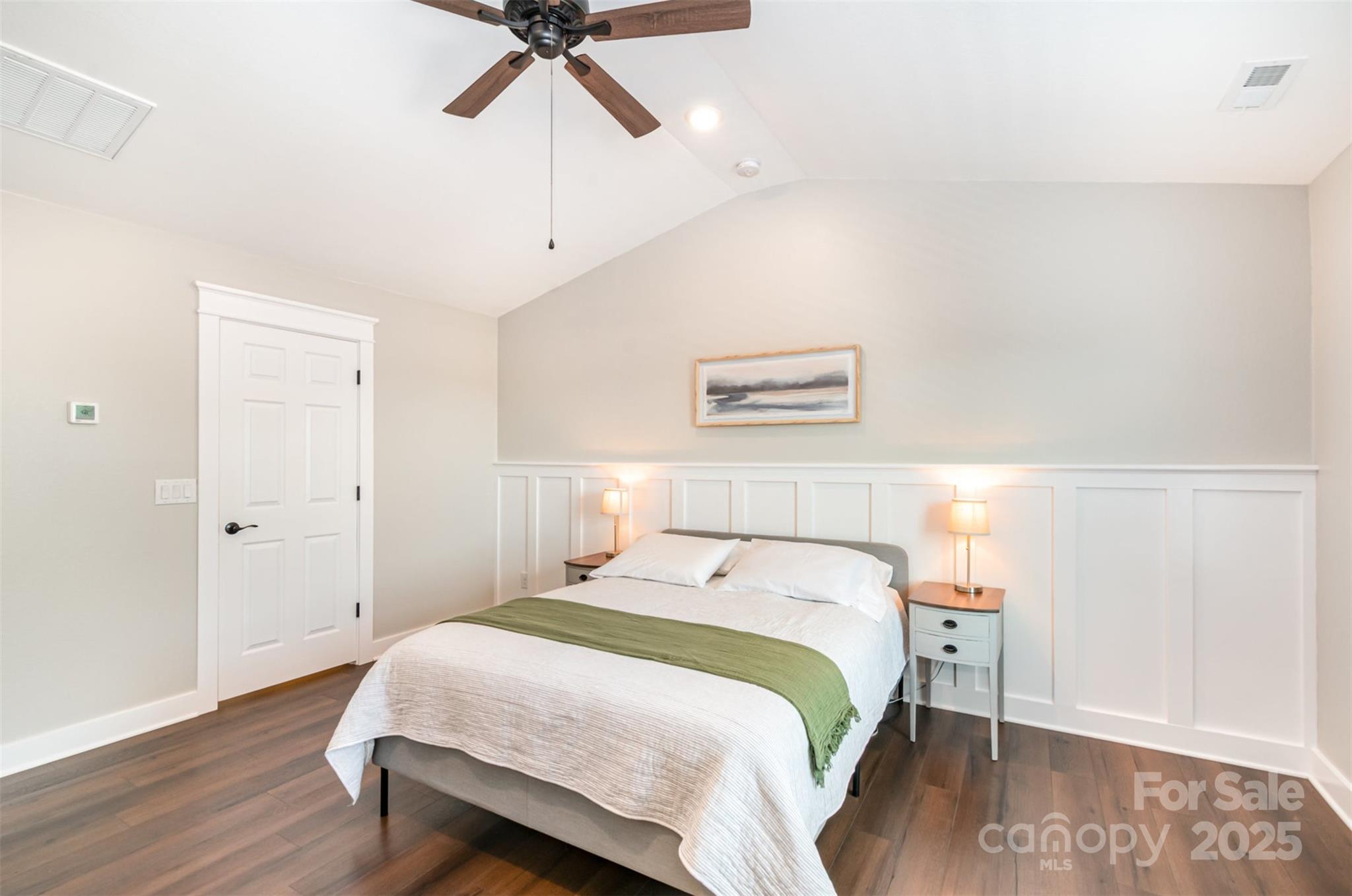 1124 Culver Spring Way Charlotte, NC 28215 - Photo 14 of 32 a bedroom with a bed and wooden floor