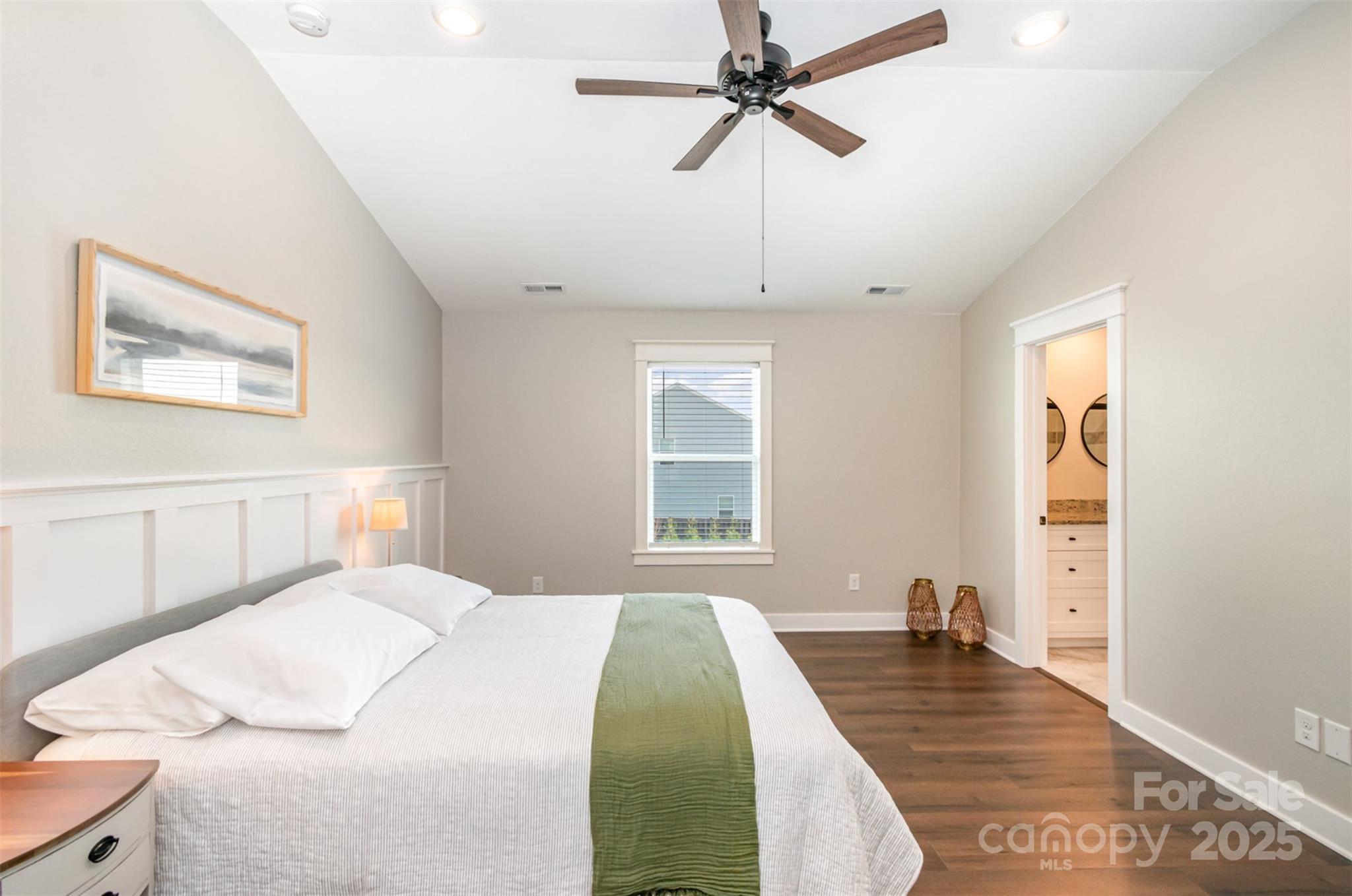 1124 Culver Spring Way Charlotte, NC 28215 - Photo 15 of 32 a bedroom with a bed and wooden floor