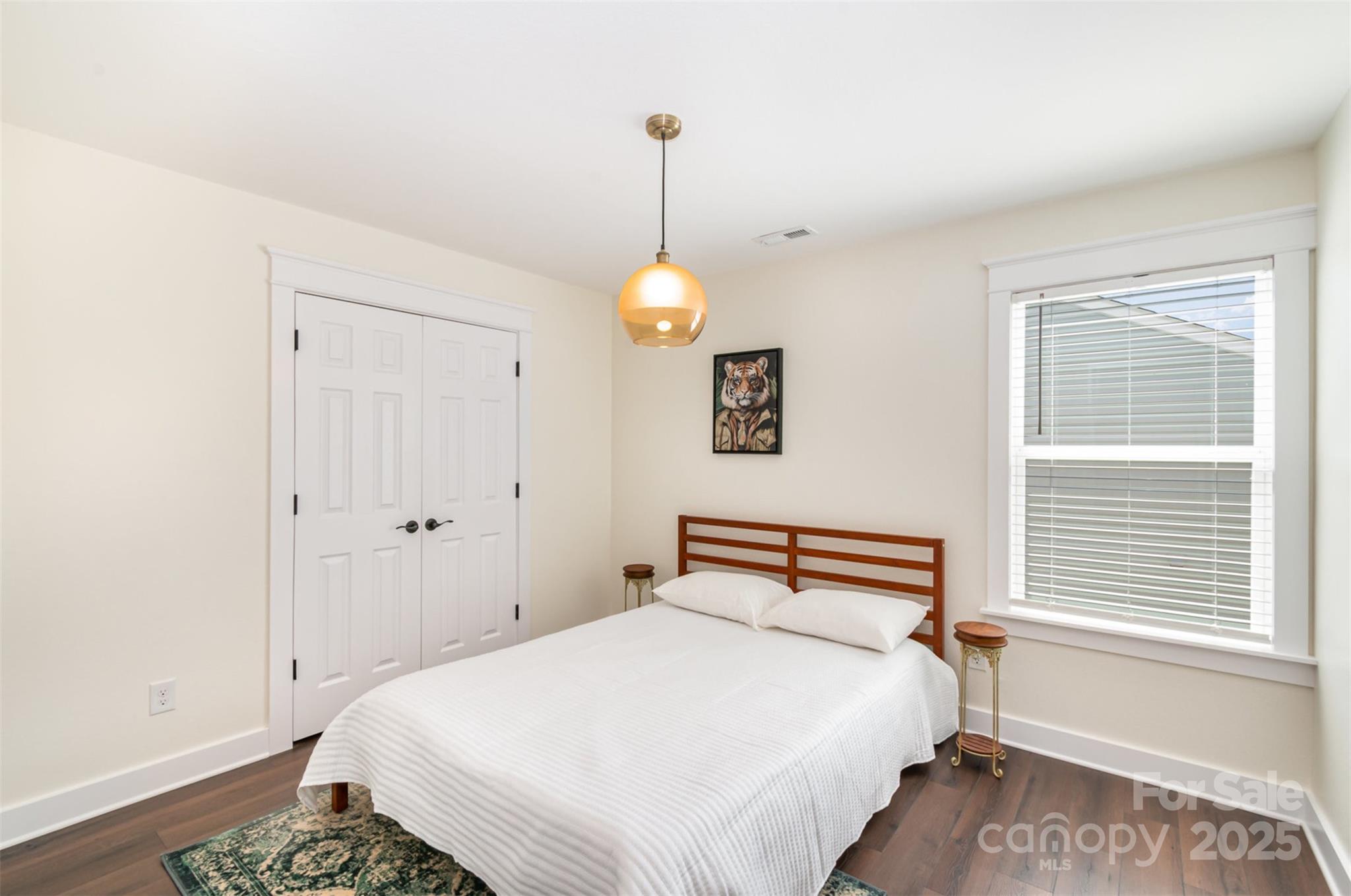 1124 Culver Spring Way Charlotte, NC 28215 - Photo 20 of 32 a bedroom with a bed and a window
