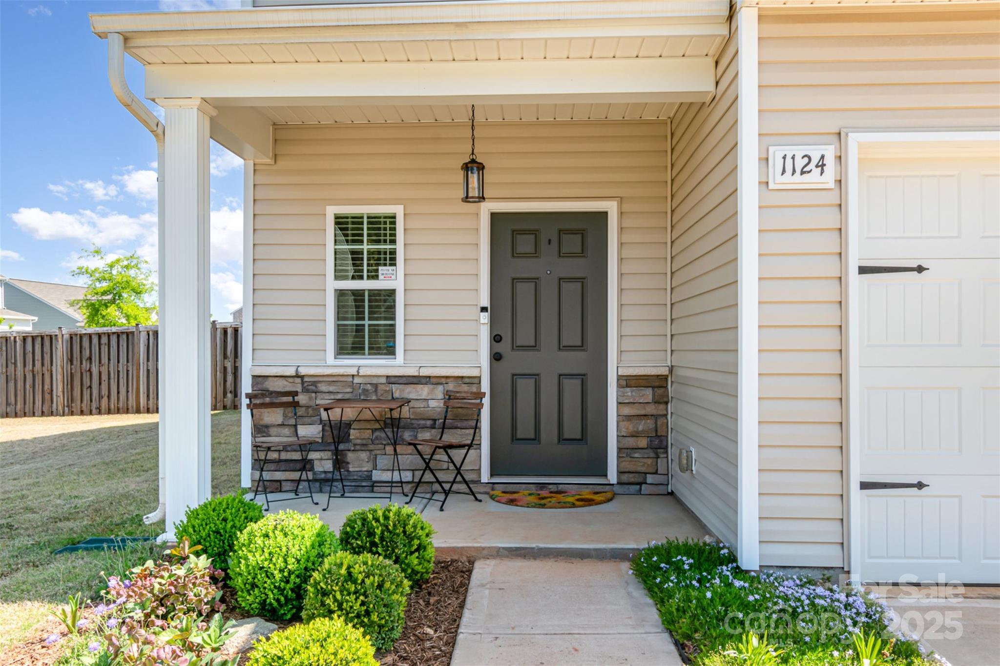 1124 Culver Spring Way Charlotte, NC 28215 - Photo 2 of 32 a front view of a house with garden