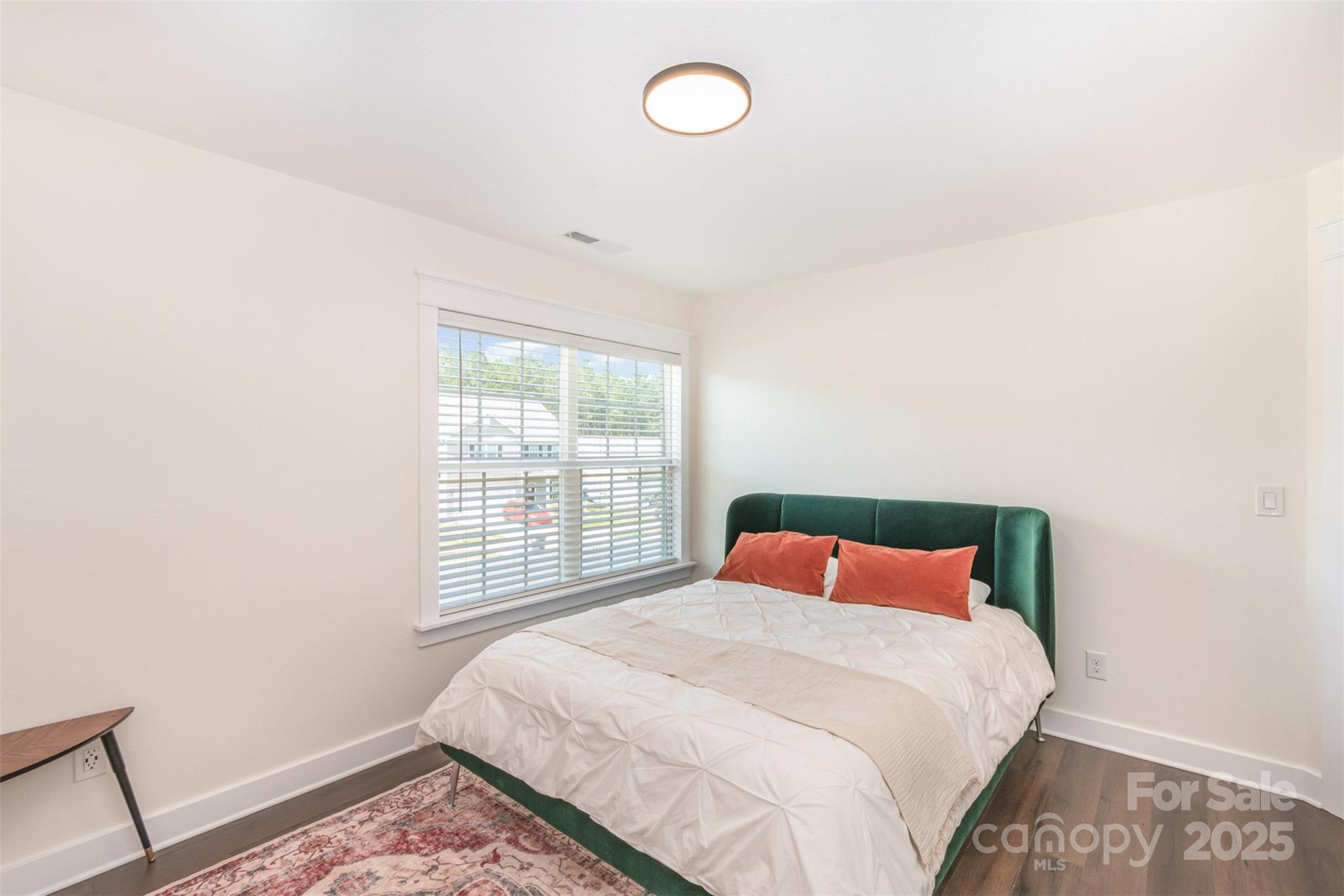 1124 Culver Spring Way Charlotte, NC 28215 - Photo 23 of 32 a bedroom with a large bed and a window