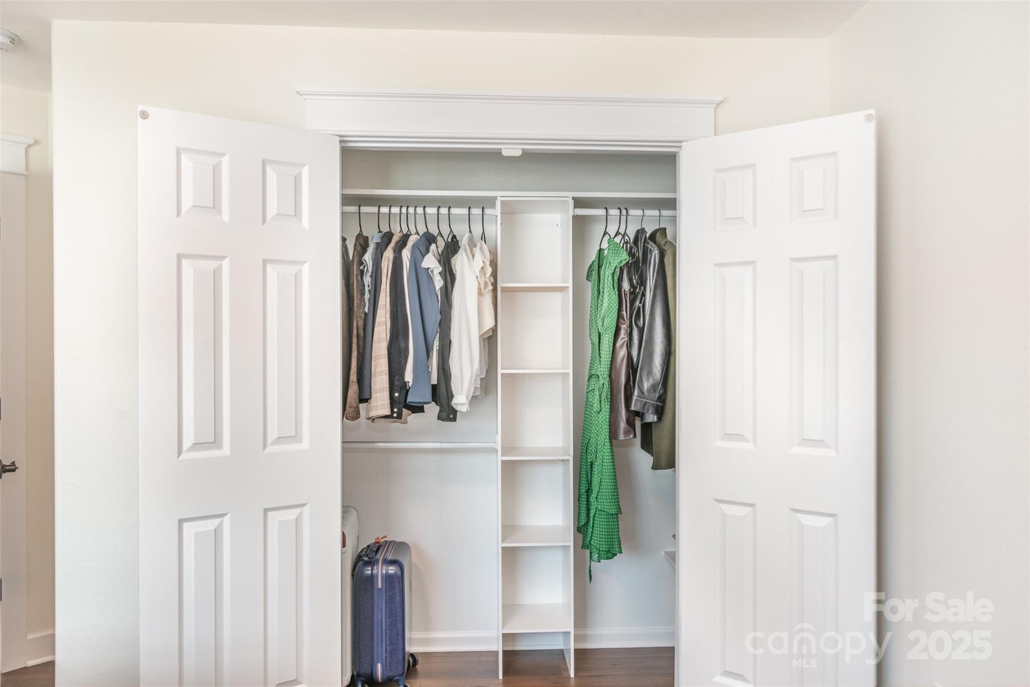 1124 Culver Spring Way Charlotte, NC 28215 - Photo 24 of 32 a view of walk in closet with clothes and shoes