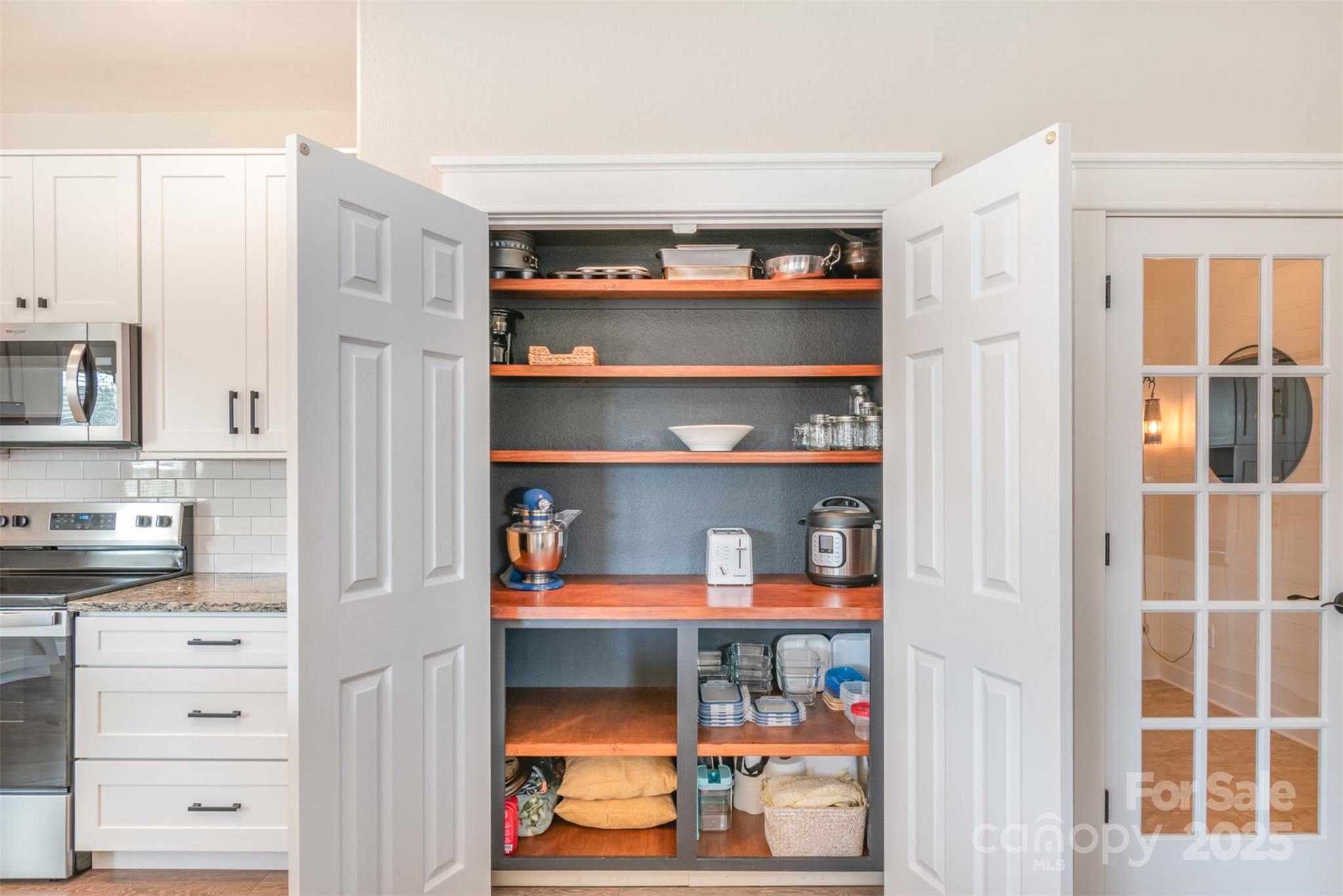 1124 Culver Spring Way Charlotte, NC 28215 - Photo 8 of 32 a view of walk in closet with clothes and shoes