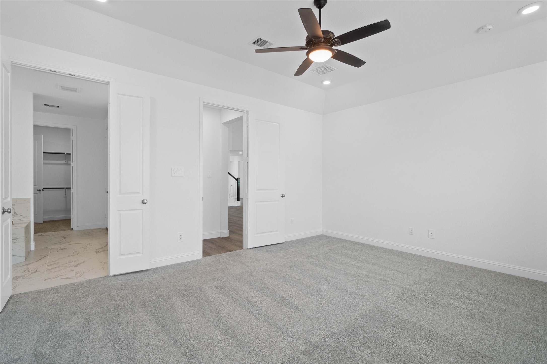 17315 July Moon Lane Conroe, TX 77302 - Photo 24 of 46 an empty room with closet and a ceiling fan