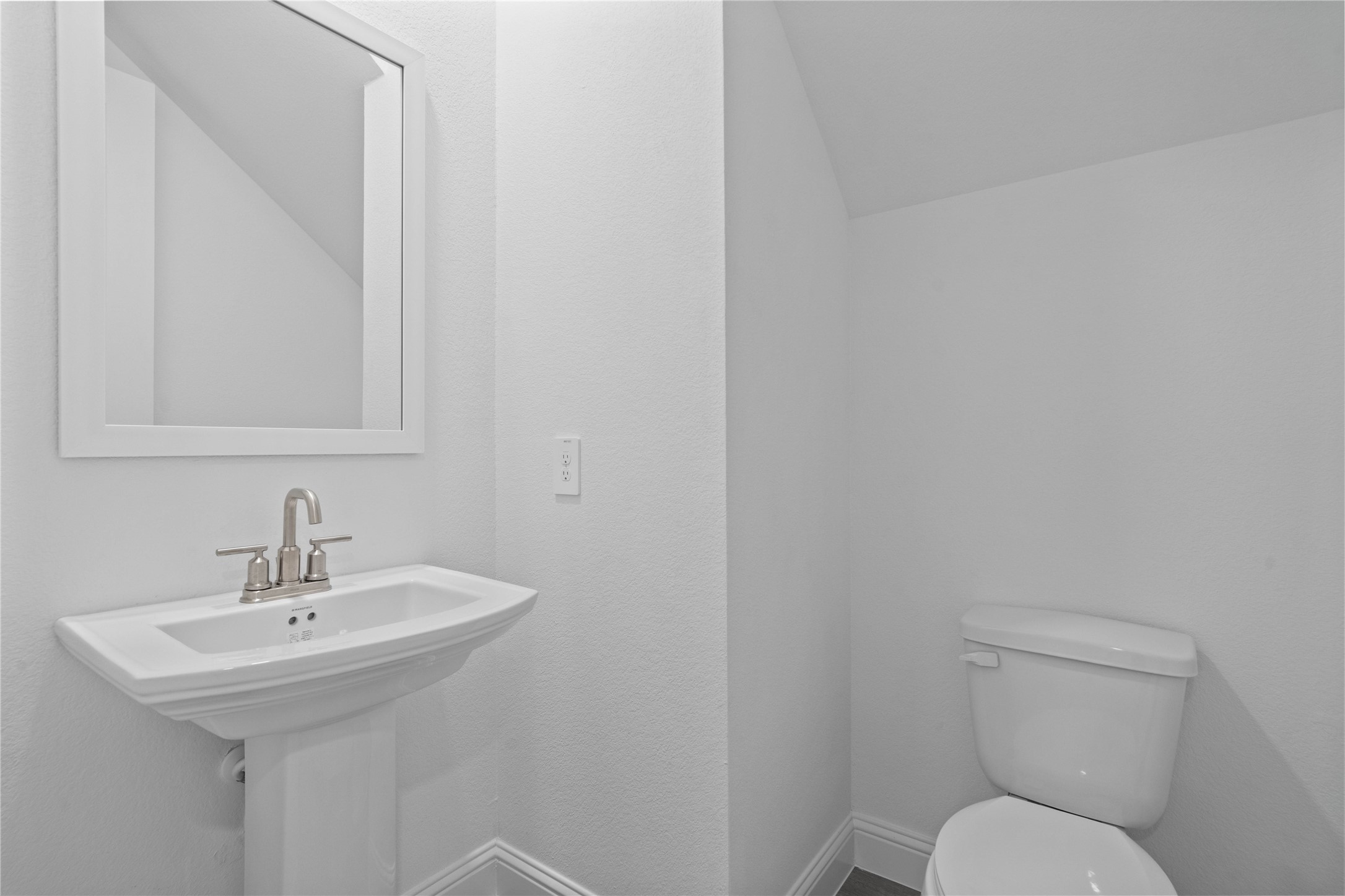 17315 July Moon Lane Conroe, TX 77302 - Photo 30 of 46 a bathroom with a toilet sink and mirror