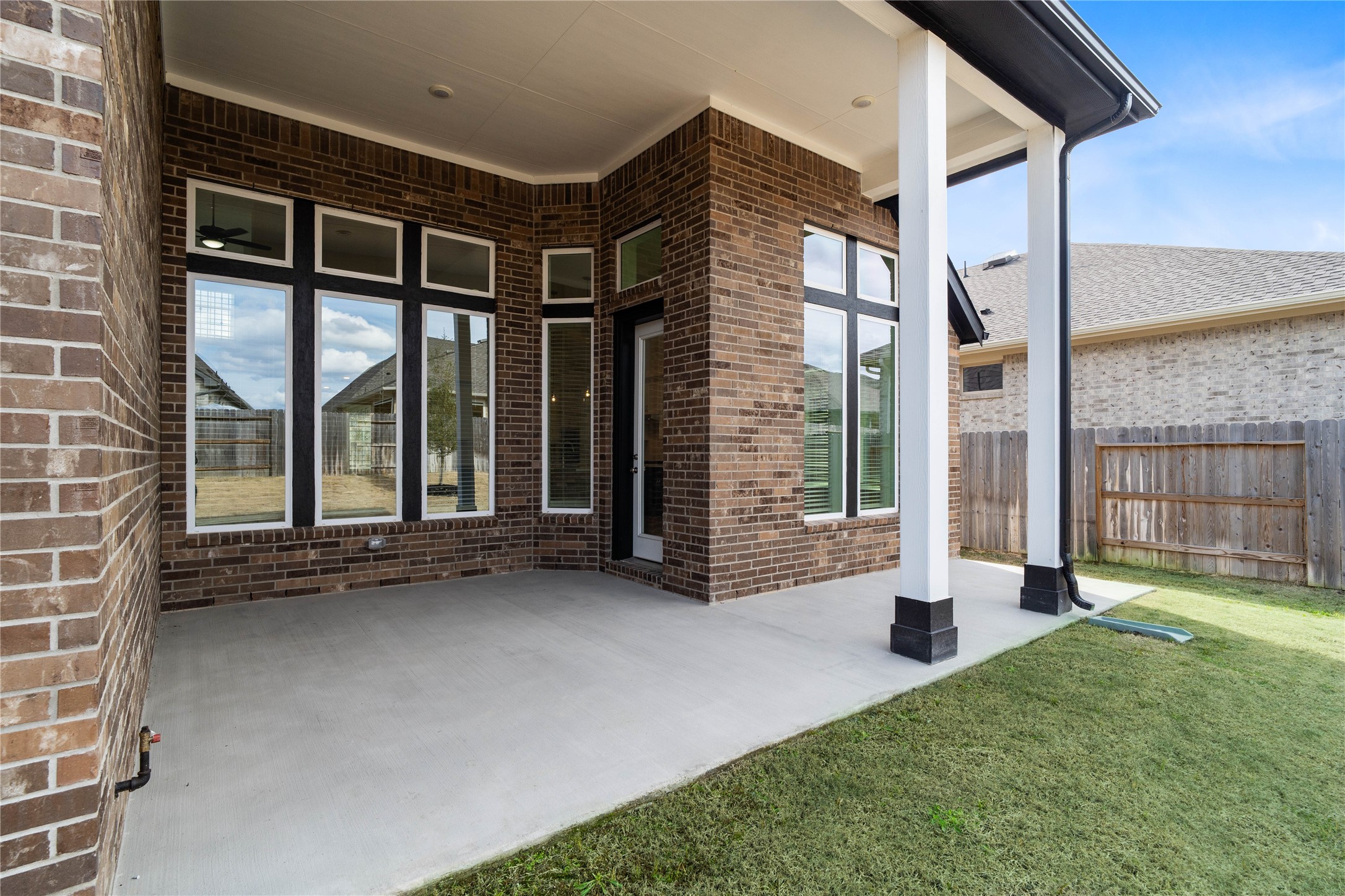 17315 July Moon Lane Conroe, TX 77302 - Photo 38 of 46 Step outside to the covered rear patio, the perfect extension of your indoor living space for year-round enjoyment.