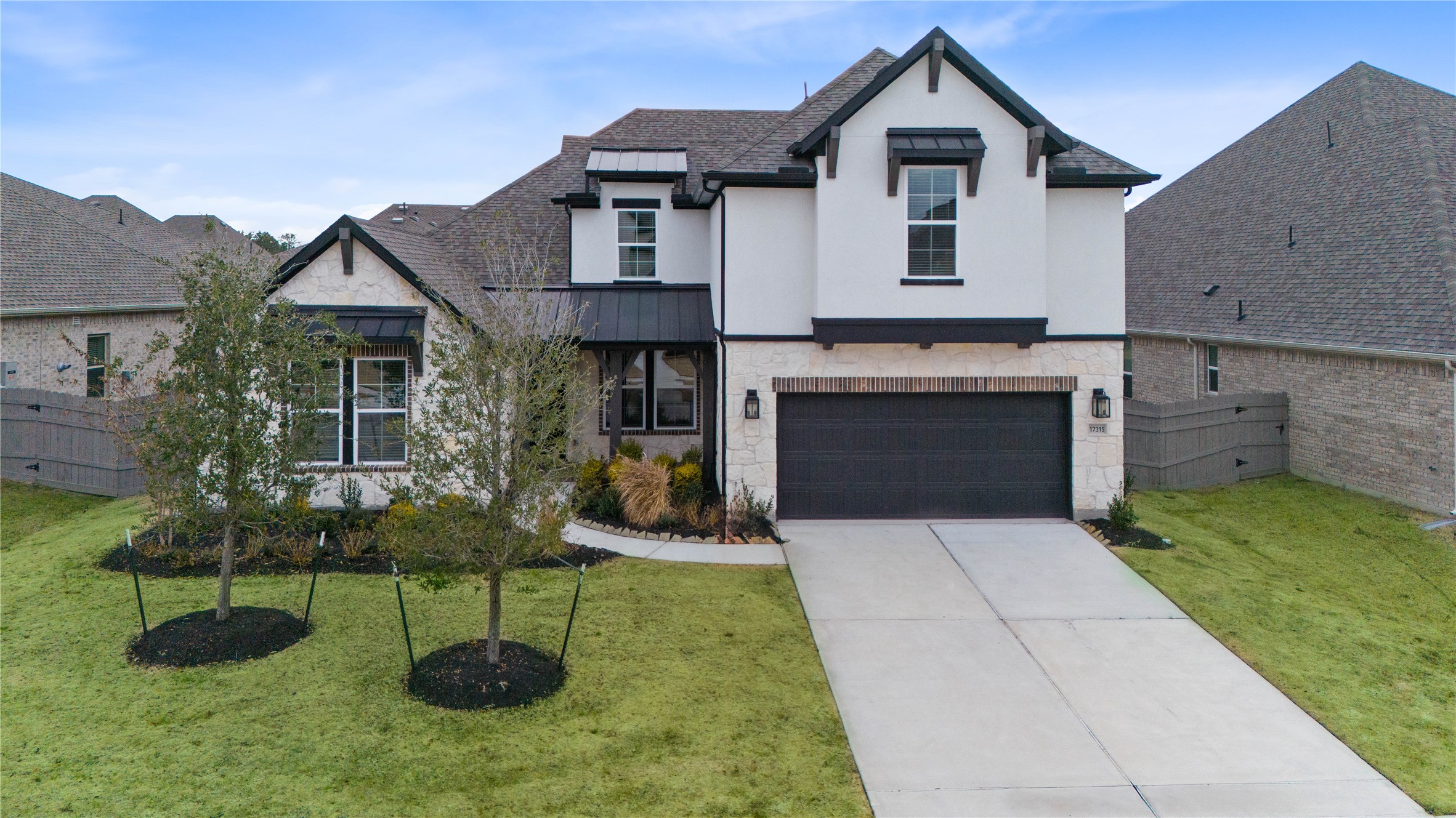 17315 July Moon Lane Conroe, TX 77302 - Photo 41 of 46 a front view of a house with a yard