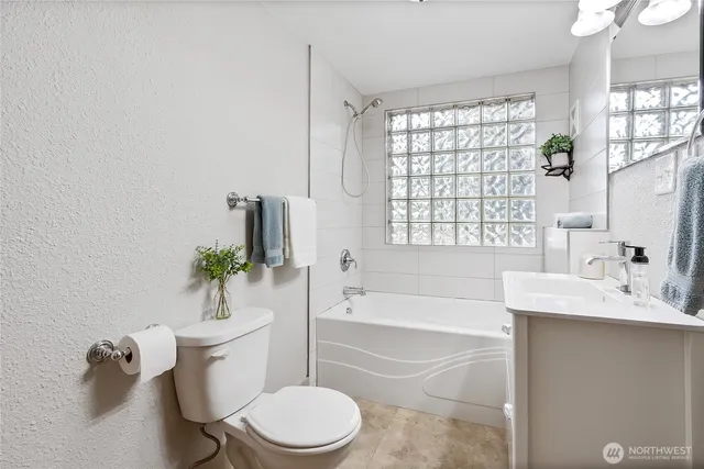 a bath room with a sink and a toilet