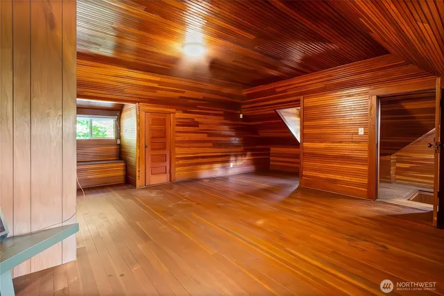 a view of room with wooden floor