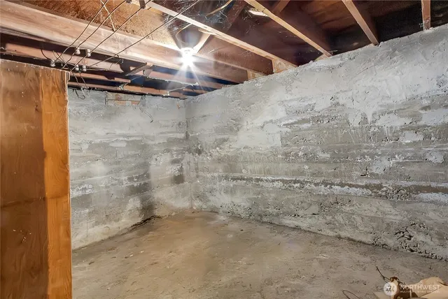 a view of a room with wooden walls