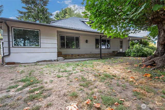 a house with trees in the background