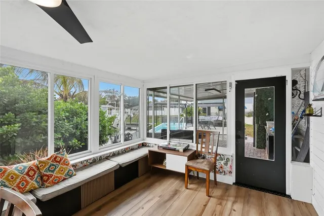 a view of a swimming pool with a table and chairs
