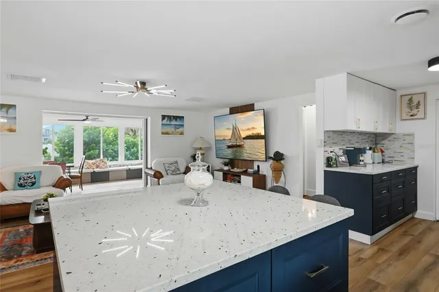 a bathroom with a sink a mirror and a shower