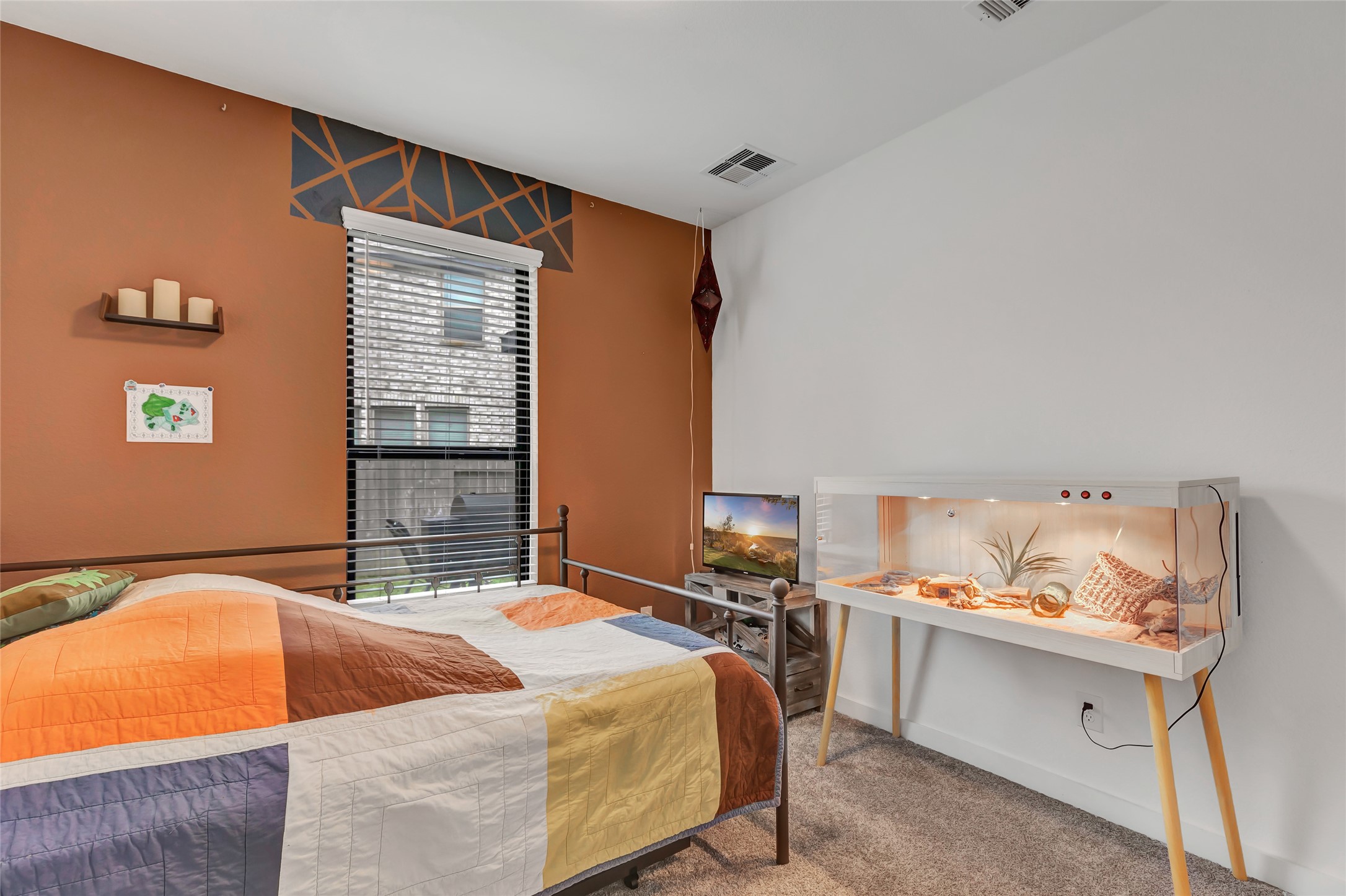 527 Chestnut Reef Court Conroe, TX 77304 - Photo 11 of 40 a bed room with a bed and a window