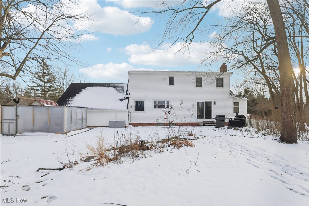 445 Center Road Hinckley, OH 44233 - Photo 36 of 50 Snow covered property featuring a chimney and a patio area