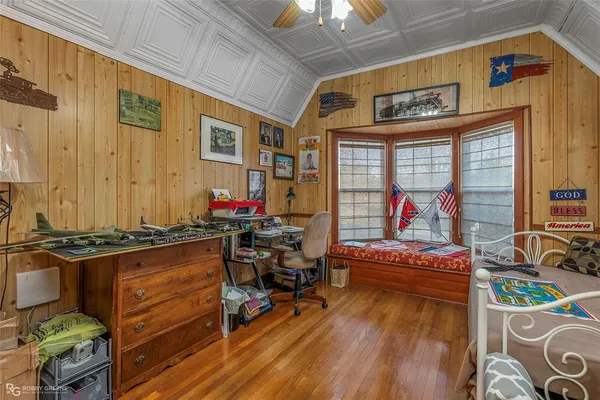 a room with furniture and a flat screen tv