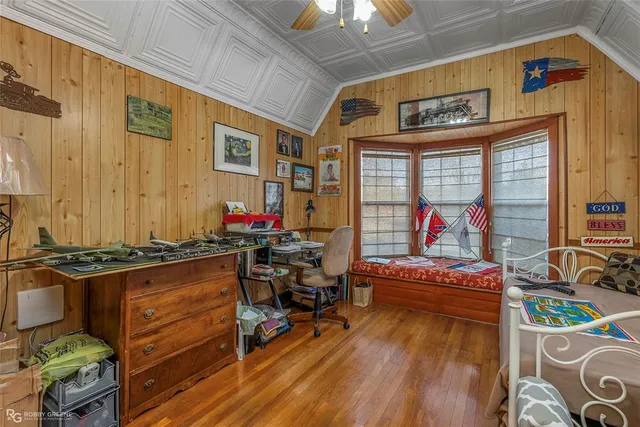 a room with furniture and a flat screen tv