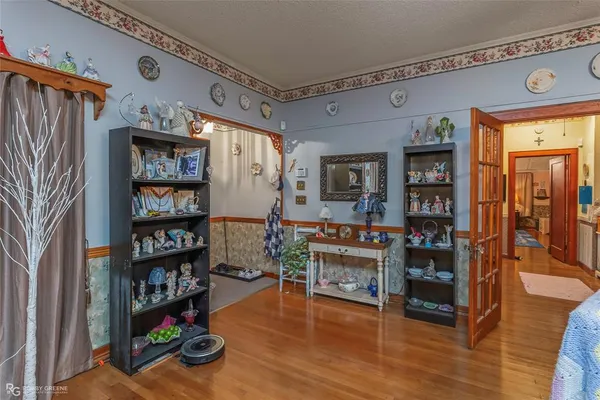 a view of a workspace with furniture and wooden floor