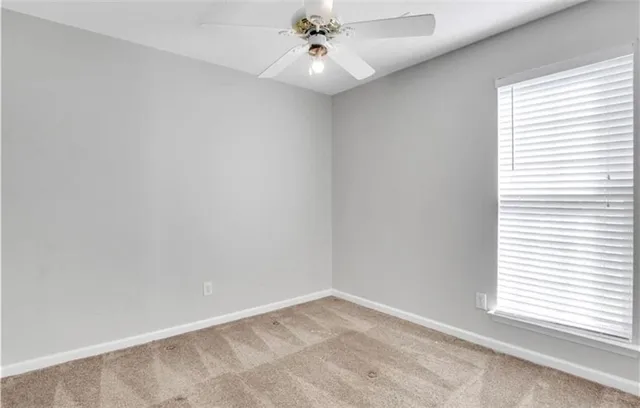an empty room with closet area