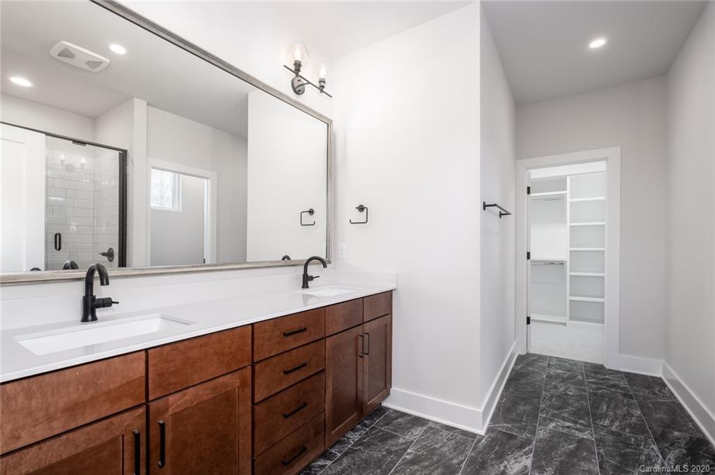 2531 Irwin Stream Road, Unit 20 Charlotte, NC 28208 - Photo 14 of 18 a bathroom with a sink and a mirror