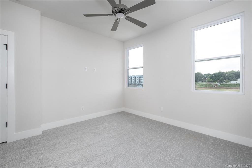 2531 Irwin Stream Road, Unit 20 Charlotte, NC 28208 - Photo 15 of 18 an empty room with a window and a fan