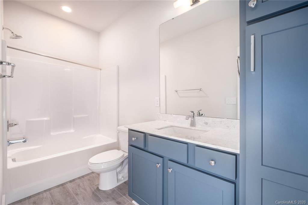 2531 Irwin Stream Road, Unit 20 Charlotte, NC 28208 - Photo 16 of 18 a bathroom with a sink a toilet and a bathtub