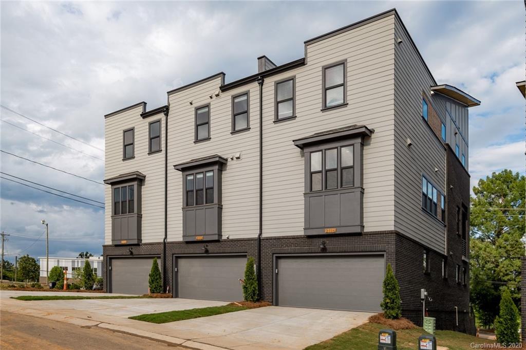 2531 Irwin Stream Road, Unit 20 Charlotte, NC 28208 - Photo 18 of 18 a front view of a house with a yard