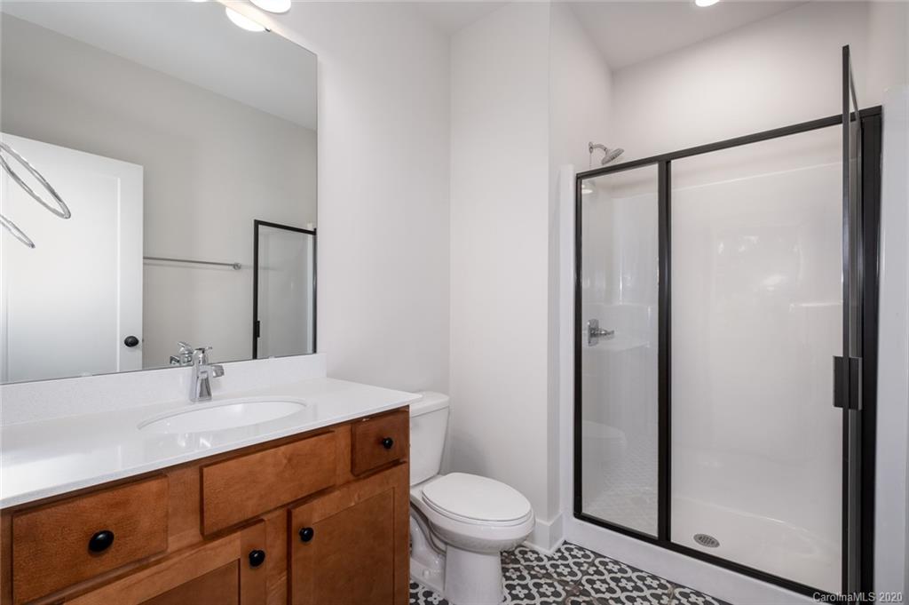 2531 Irwin Stream Road, Unit 20 Charlotte, NC 28208 - Photo 4 of 18 a bathroom with a sink toilet and shower