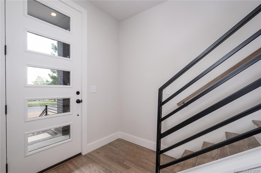 2531 Irwin Stream Road, Unit 20 Charlotte, NC 28208 - Photo 5 of 18 a view of entryway and hall with wooden floor