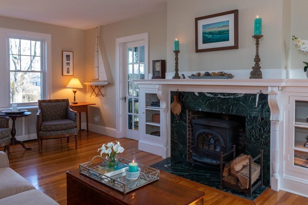 1 Mitchell Road Marblehead, MA 01945 - Photo 7 of 22 a living room with furniture and a fireplace