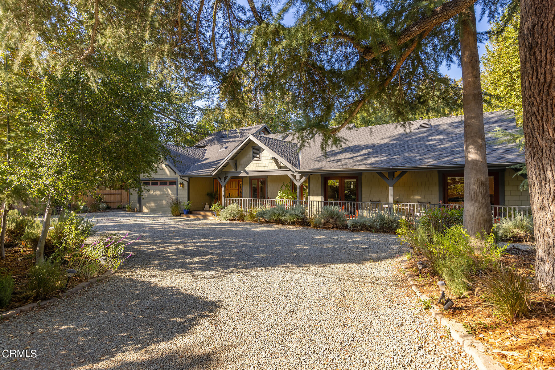 487 Gridley Road Ojai, CA 93023 - Photo 1 of 22 a front view of a house with a yard and garage
