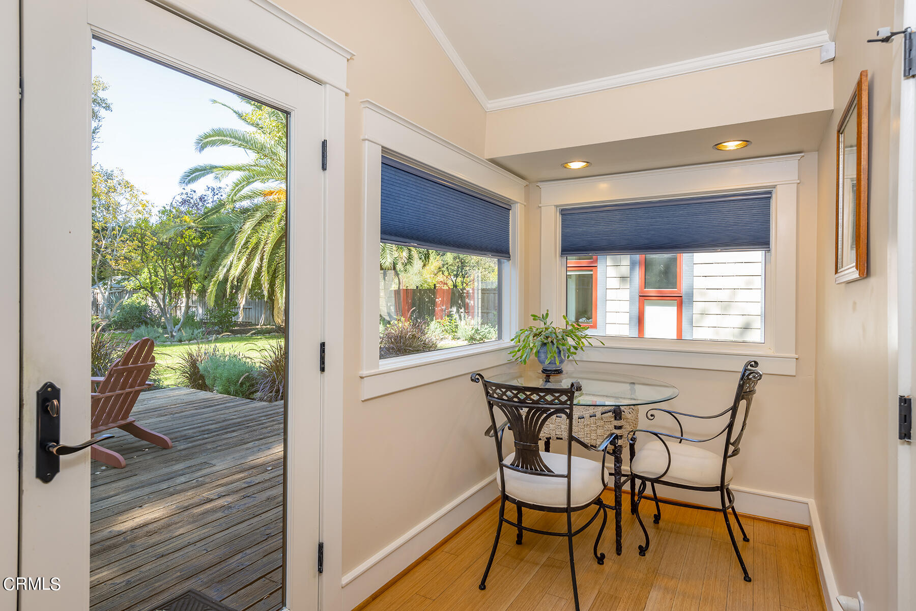 487 Gridley Road Ojai, CA 93023 - Photo 11 of 22 a dining room with furniture a chandelier and wooden floor