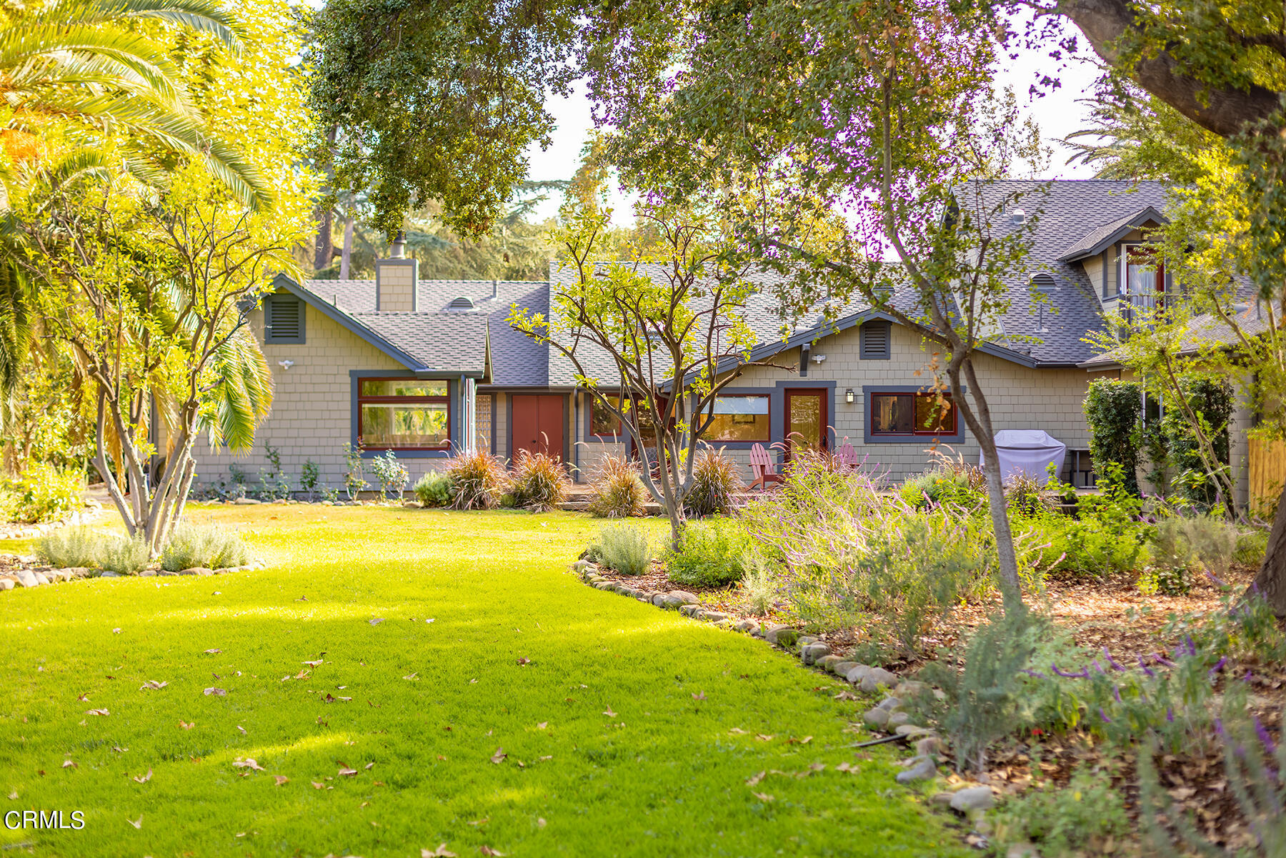 487 Gridley Road Ojai, CA 93023 - Photo 3 of 22 a front view of a house with yard and green space