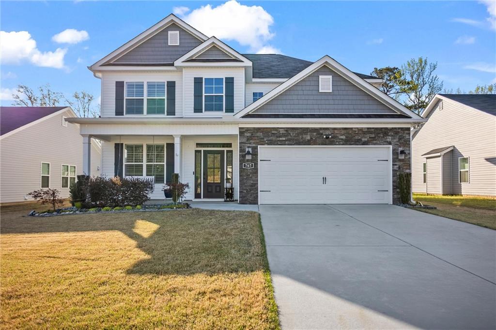 a front view of a house with swimming pool