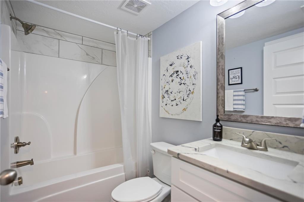 767 Fordham Road Grovetown, GA 30813 - Photo 11 of 32 a bathroom with a granite countertop sink toilet and shower
