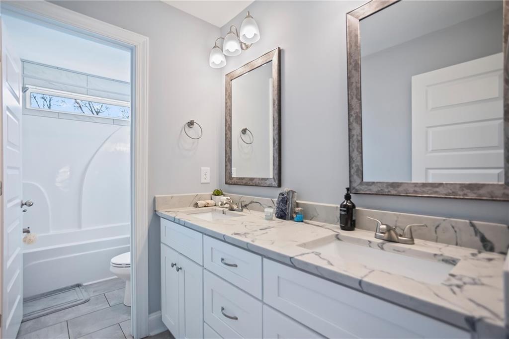 767 Fordham Road Grovetown, GA 30813 - Photo 17 of 32 a bathroom with a granite countertop sink toilet and shower