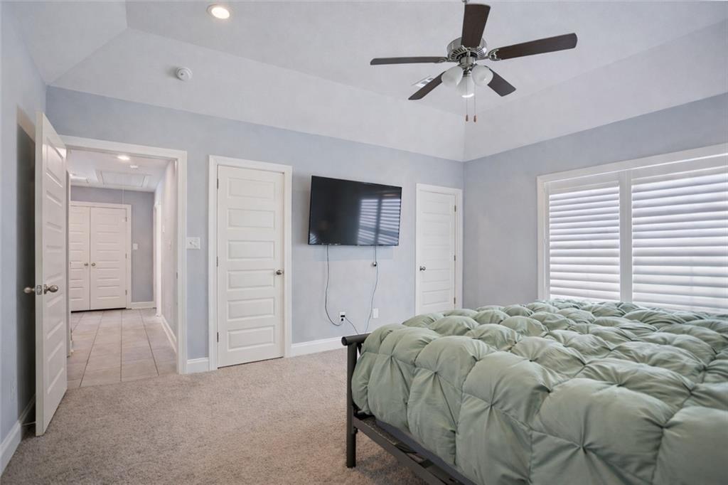767 Fordham Road Grovetown, GA 30813 - Photo 20 of 32 a spacious bedroom with a bed and a flat screen tv