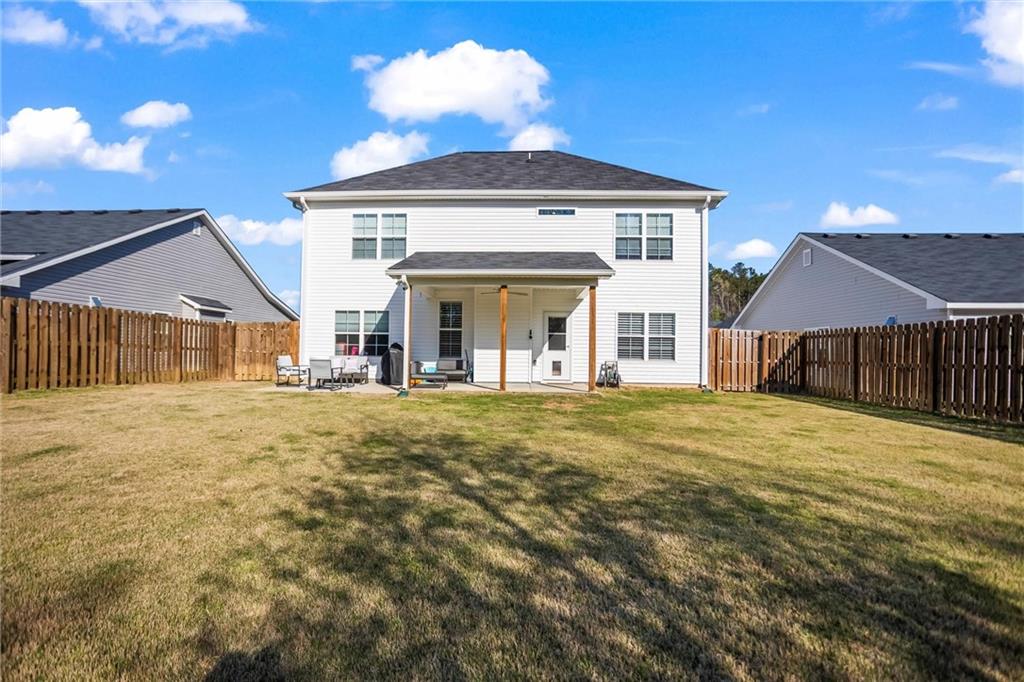 767 Fordham Road Grovetown, GA 30813 - Photo 5 of 32 a view of a house with wooden deck and a big yard