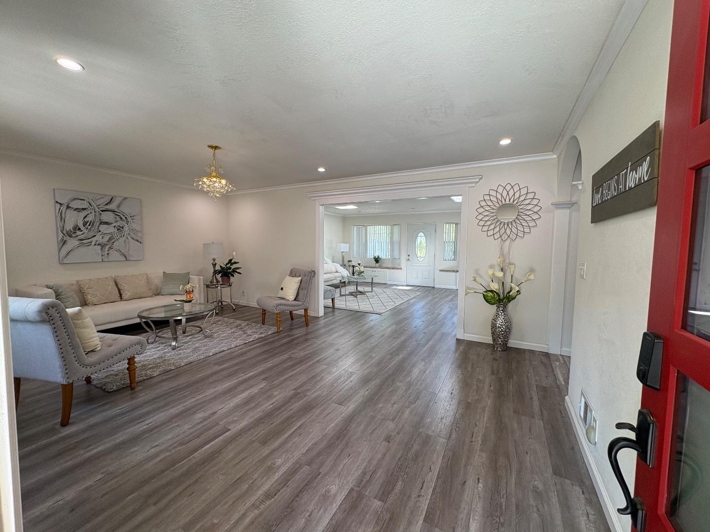 5187 Doyle Road San Jose, CA 95129 - Photo 4 of 39 a living room with furniture and a wooden floor