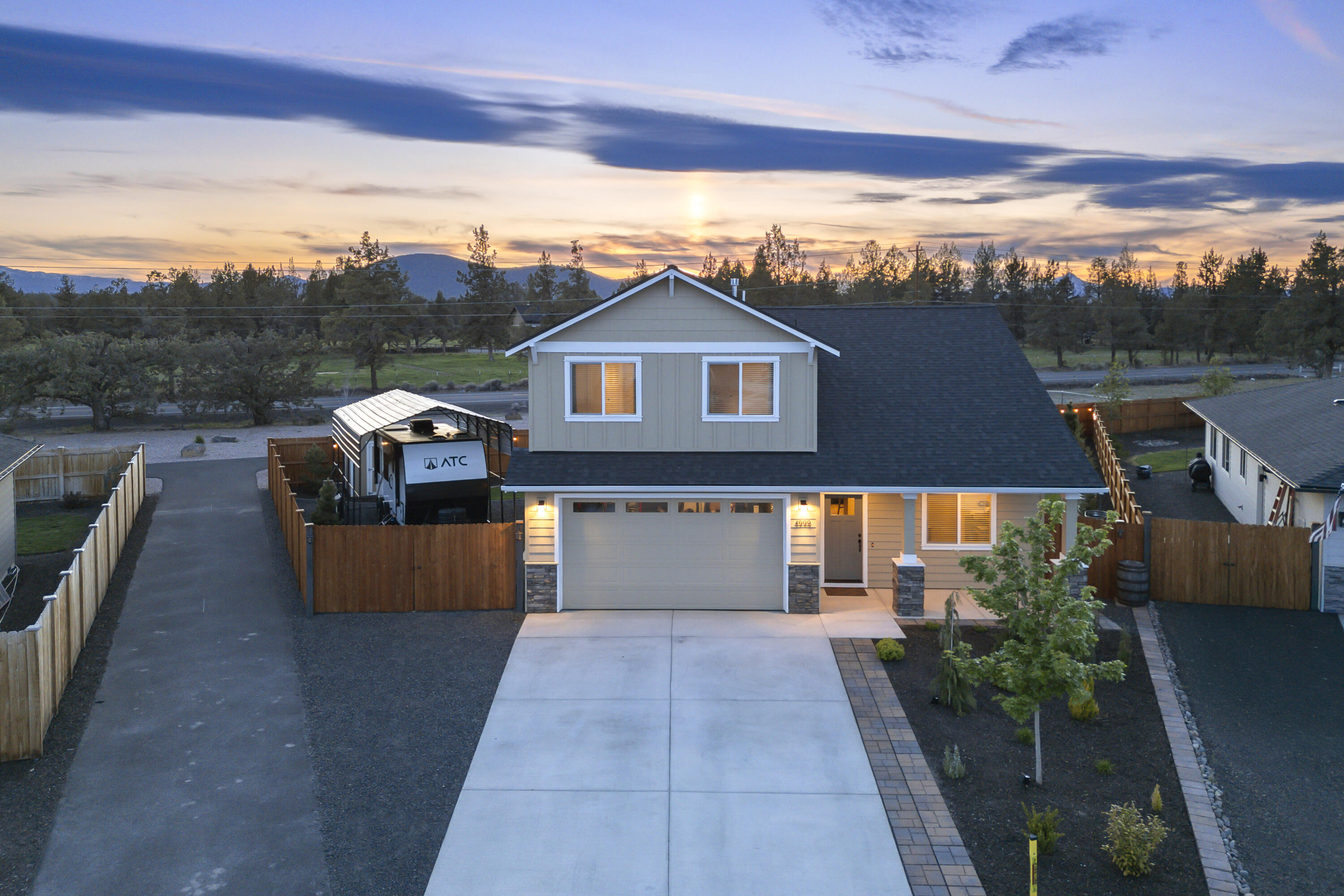 4999 Southwest Yew Place Redmond, OR 97756 - Photo 1 of 50 a front view of a house with a yard