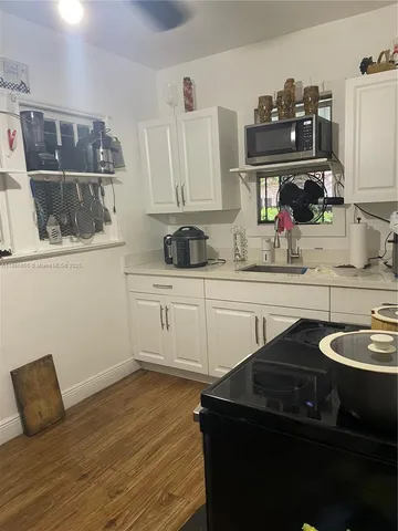 a kitchen with a sink and cabinets