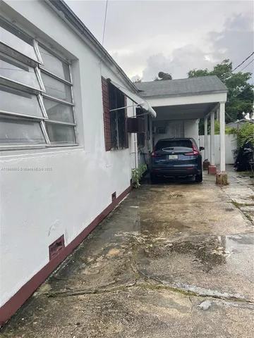 a car parked in front of a house