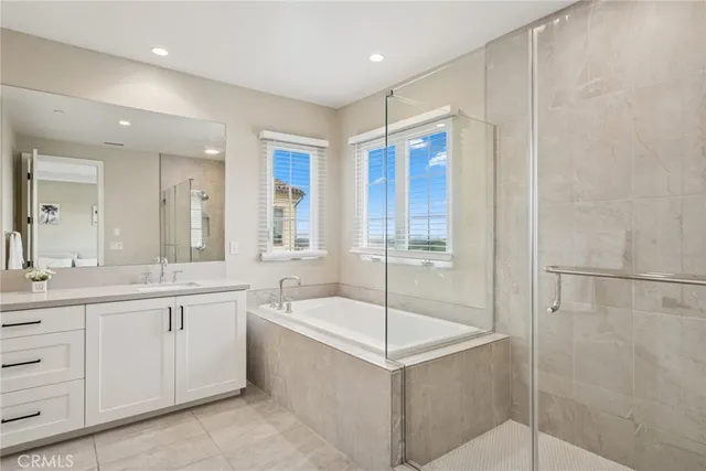 a bathroom with a mirror sink and a shower