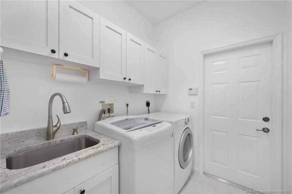 2227 Southeast Stonehaven Road Port St. Lucie, FL 34952 - Photo 20 of 35 a utility room with sink dryer and washer